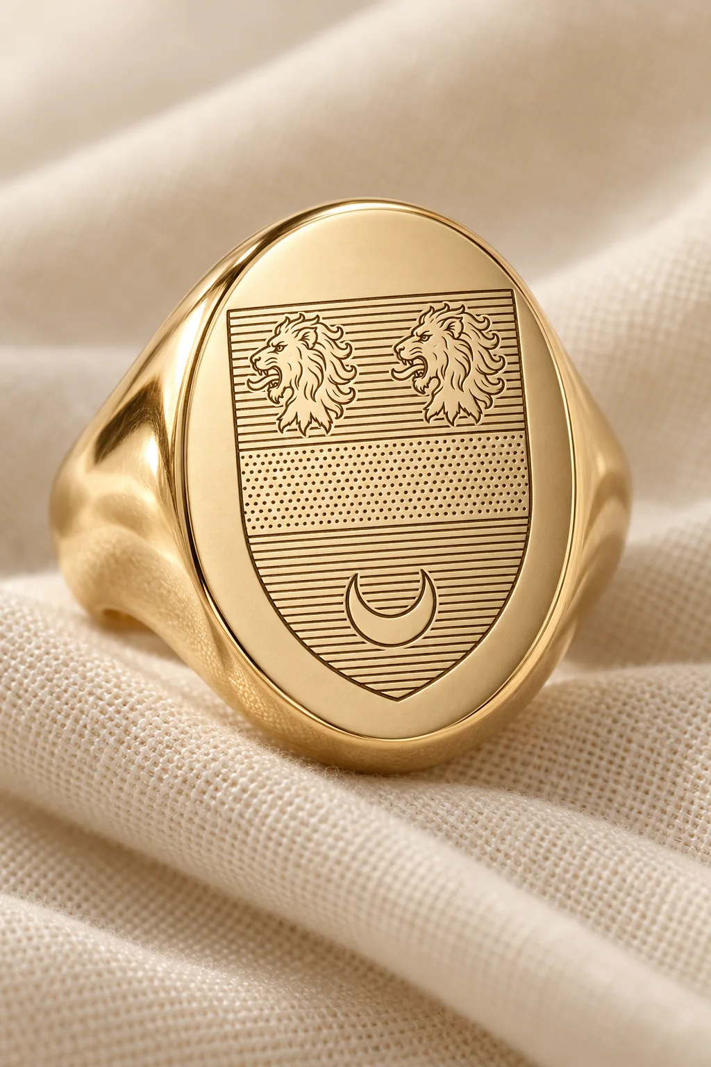 An oval signet ring engraved with a crest on cream linen